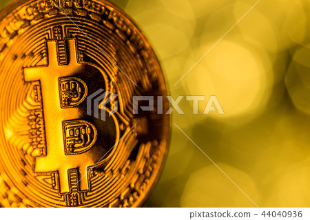 Bitcoin gold coin with defocused abstract background. Virtual cryptocurrency concept. Bitcoin gold coin with defocused abstract background. Virtual cryptocurrency concept. 44040936
