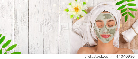 Young healthy woman with face clay mask. 44040956