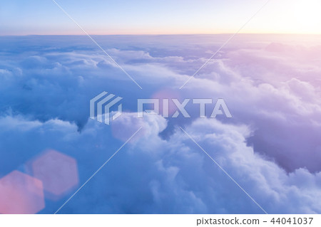 Beautiful sunset with cloudy sky from the airplane window. 44041037