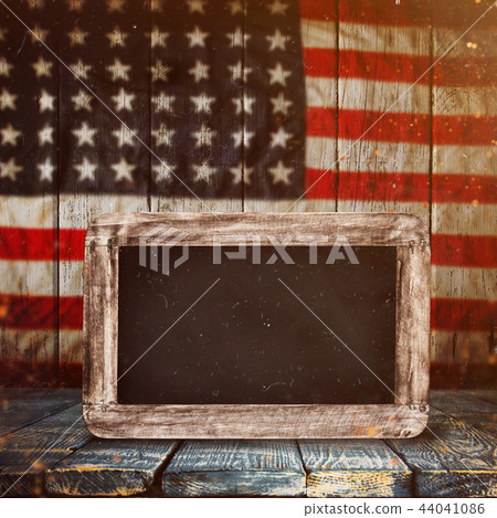 Empty wooden table over vintage USA flag background. Empty wooden table over vintage USA flag background. 44041086