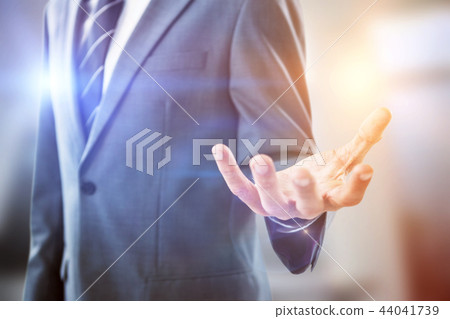 Composite image of midsection of businessman indicating Composite image of midsection of businessman indicating 44041739