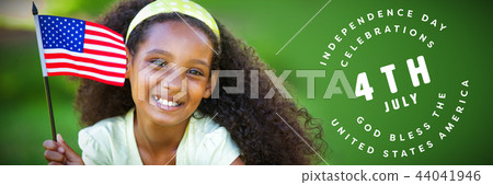 Composite image of young girl celebrating independence day in the park 44041946