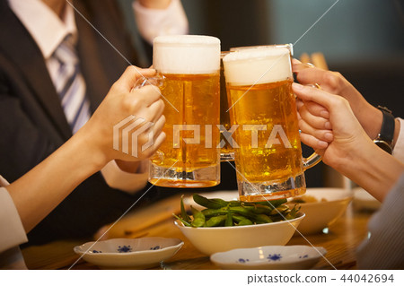 Working people drinking alcohol 44042694