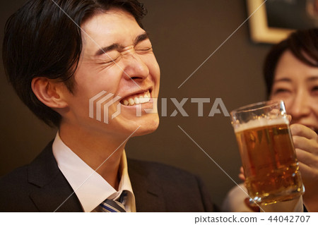 Working people drinking alcohol 44042707