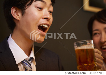 Working people drinking alcohol Working people drinking alcohol 44042709