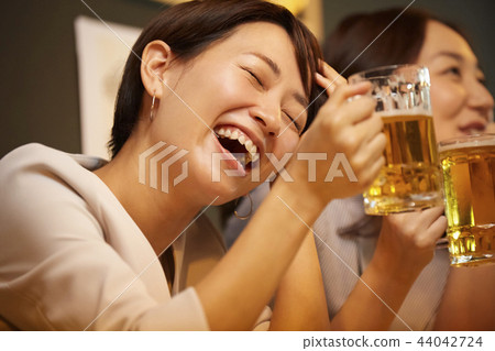 Working people drinking alcohol Working people drinking alcohol 44042724