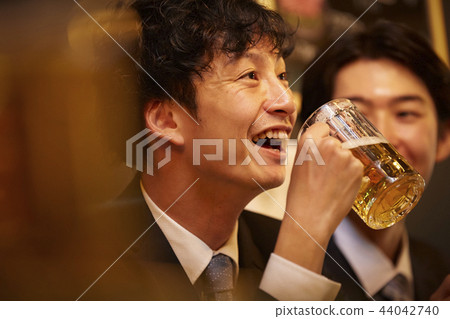 Working people drinking alcohol 44042740