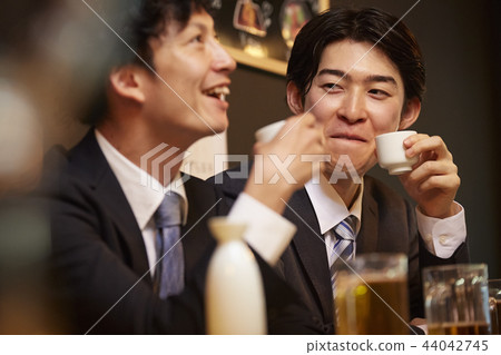 Working people drinking alcohol 44042745