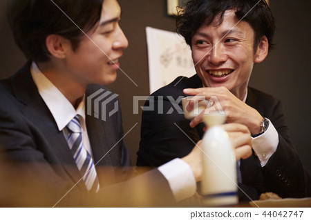 Working people drinking alcohol Working people drinking alcohol 44042747
