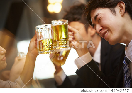 Working people drinking alcohol Working people drinking alcohol 44042757
