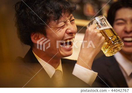 Working people drinking alcohol 44042767