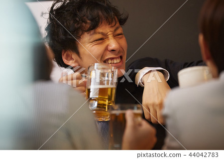 Working people drinking alcohol 44042783