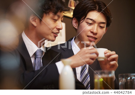 Working people drinking alcohol 44042784