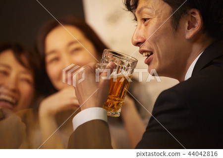 Working people drinking alcohol 44042816