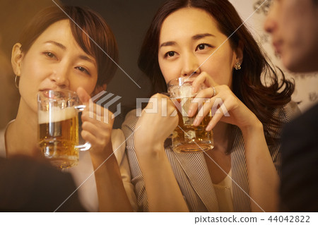 Working people drinking alcohol Working people drinking alcohol 44042822