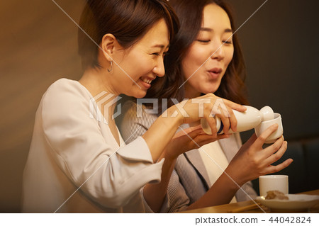 Working people drinking alcohol 44042824