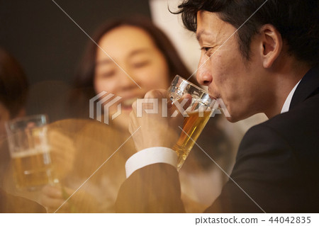 Working people drinking alcohol 44042835
