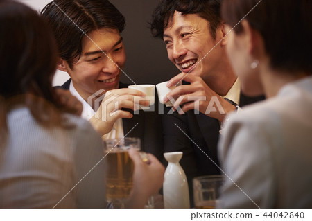 Working people drinking alcohol 44042840