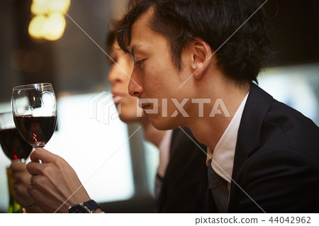 Working people drinking alcohol Working people drinking alcohol 44042962