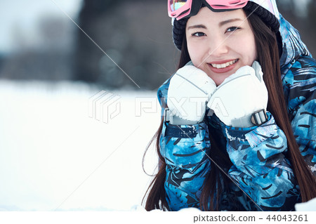 Ski resort woman Ski resort woman 44043261