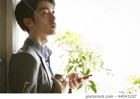 Men drinking alcohol in the room 44043287