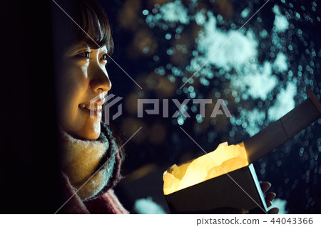 A woman with a present A woman with a present 44043366