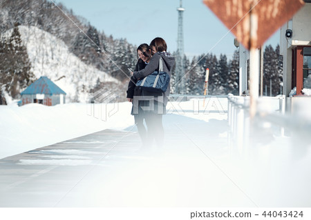High school girl in snowy country High school girl in snowy country 44043424