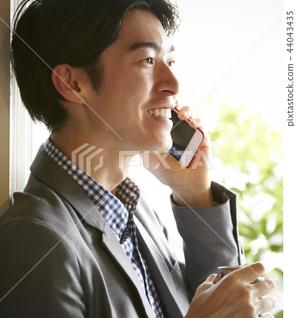 Men drinking alcohol in the room Men drinking alcohol in the room 44043435