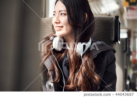 High school girl taking a train High school girl taking a train 44043687