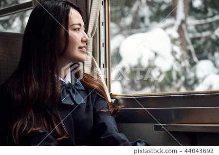 High school girl taking a train 44043692
