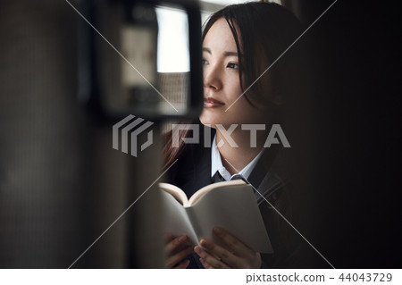 High school girl taking a train High school girl taking a train 44043729