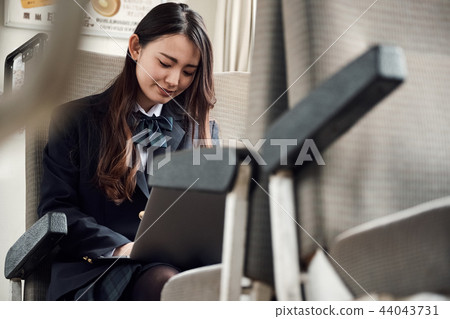 High school girl taking a train 44043731