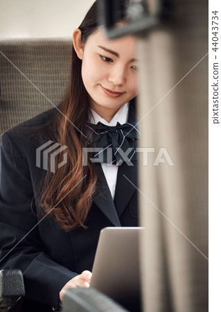 High school girl taking a train 44043734