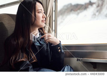 High school girl taking a train High school girl taking a train 44043800