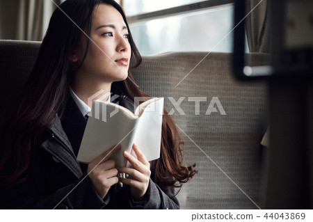 High school girl taking a train 44043869