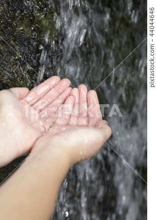 Hands receiving cold valley water Hands receiving cold valley water 44044646
