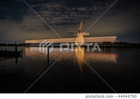 the windmills in Kinderdijk are illuminated the windmills in Kinderdijk are illuminated 44044790