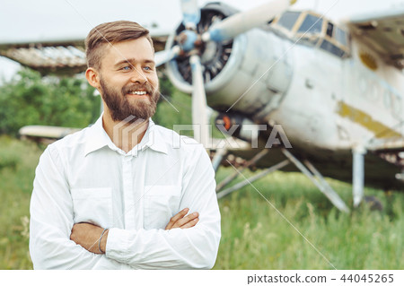 a man on the background of an old plane 44045265