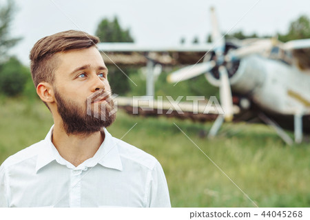 a man on the background of an old plane 44045268