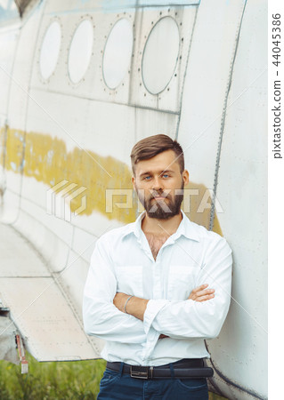 a man on the background of an old plane a man on the background of an old plane 44045386