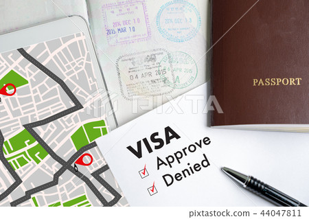 Visa and passport to approved stamped on a  44047811