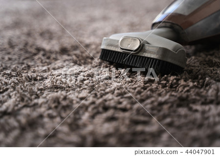 Close-up Of man using A Vacuum Cleaner Close-up Of man using A Vacuum Cleaner 44047901