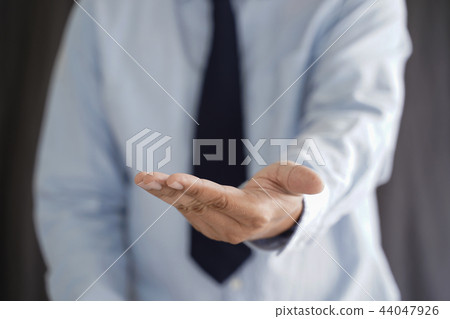 Business man hold the smartphone on the street Business man hold the smartphone on the street 44047926