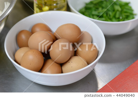 eggs in white bowl 44049040