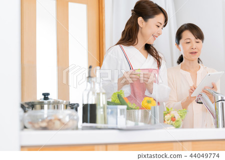 A woman making cooking A woman making cooking 44049774