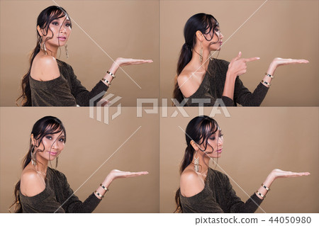 Woman looking an idea and pointing to left side Woman looking an idea and pointing to left side 44050980