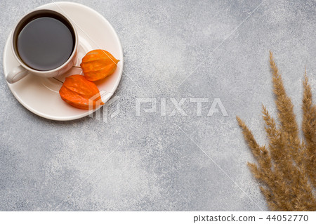 Autumn flowers and a Cup of coffee 44052770