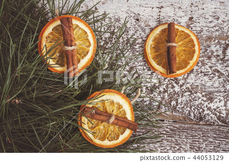 pine branches, dried orange and cinnamon sticks 44053129