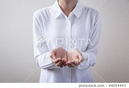 Female hand holding something 44054441