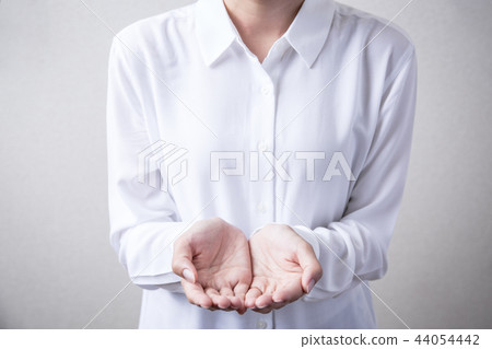 Female hand holding something 44054442